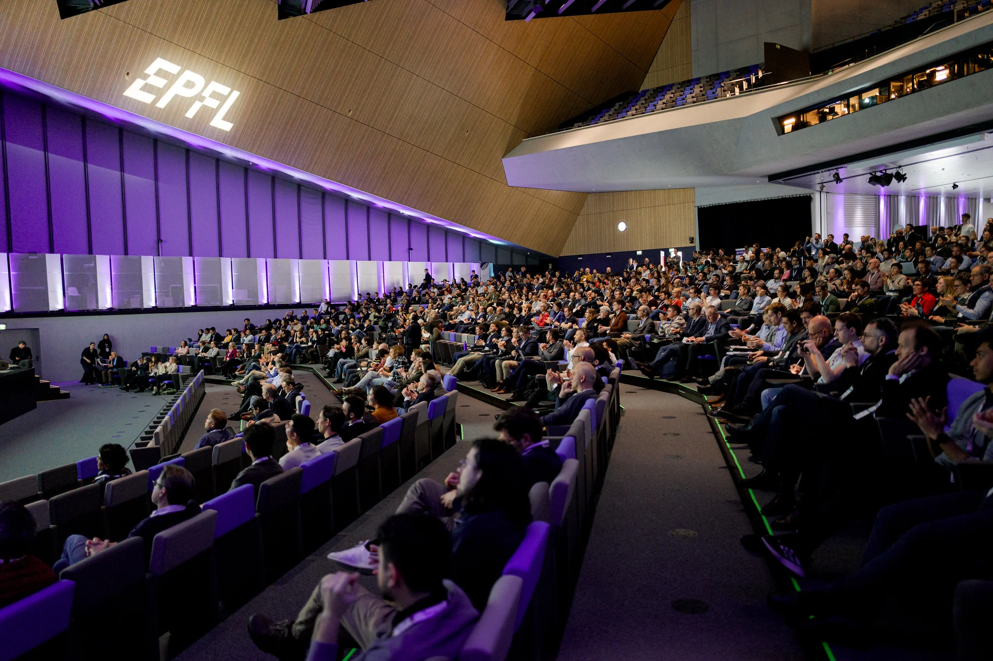 Audience in filled auditorium