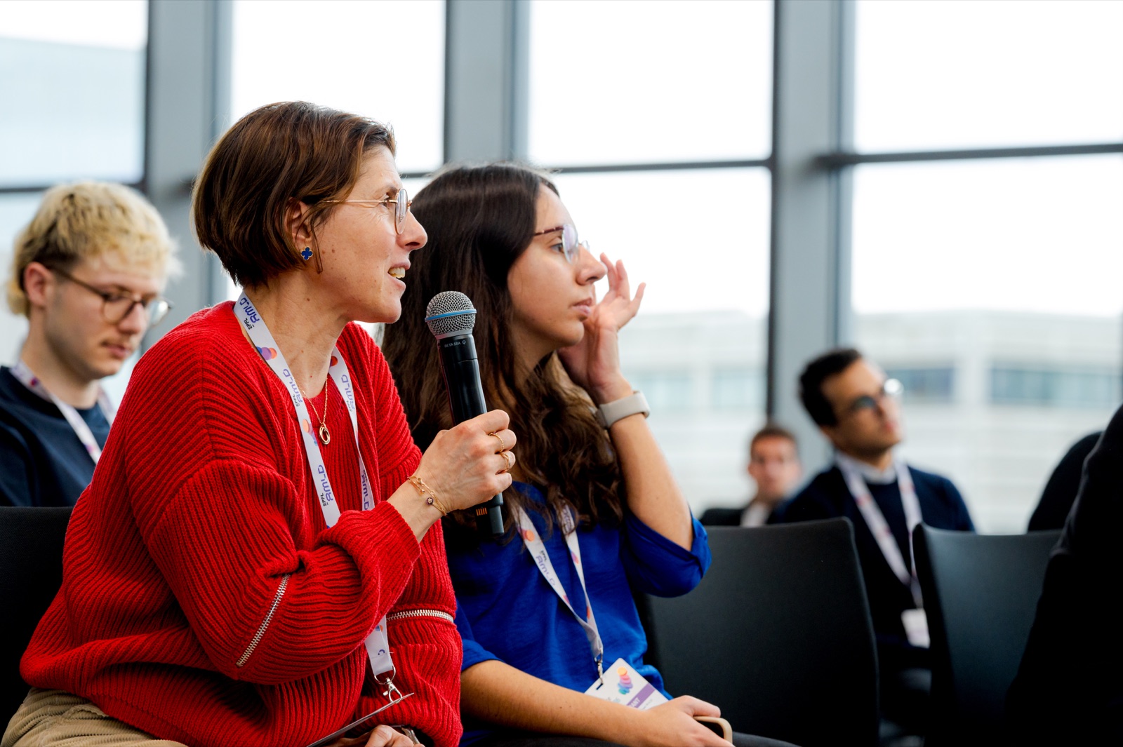 Participant asking a question at the Open Stage