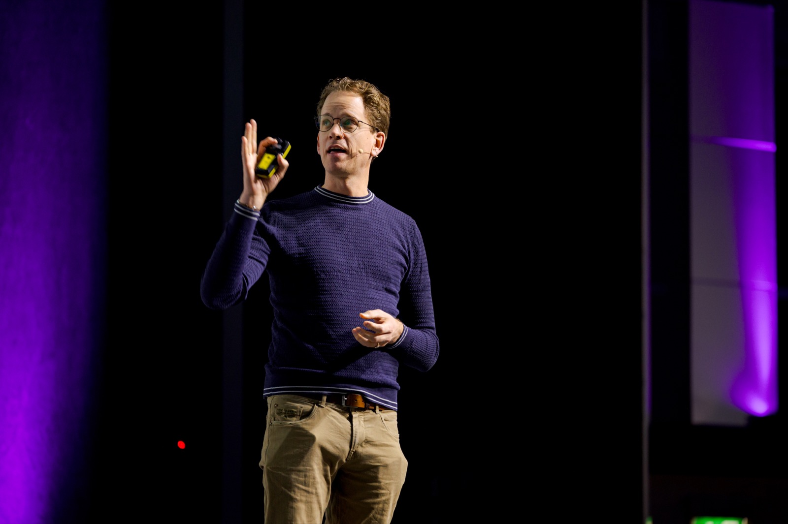 Speaker on stage at AMLD