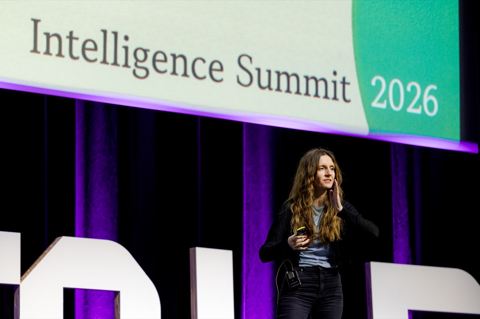 Keynote speaker on stage at the AMLD Intelligence Summit